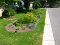 Lakeview Third St Mississauga After retrofit with permeable pavement driveway and bioswale.JPG